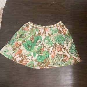 Green mini skirt with gold studs